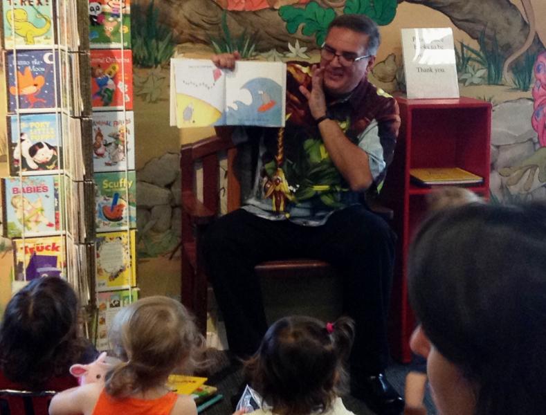 Photo of Mr. Steve reading during story time