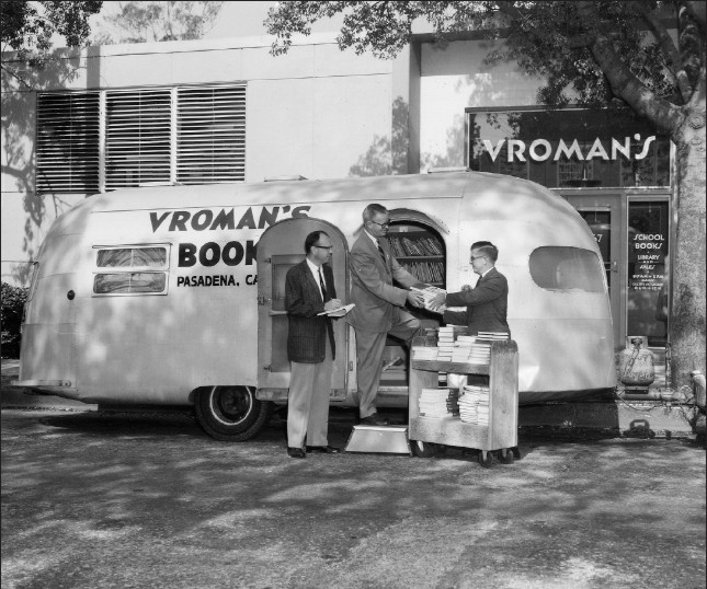Black and white photo of the Vroman's Book Mobile parked outside the old storefront
